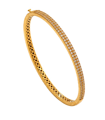 Gold bracelet with diamond accents on a white background