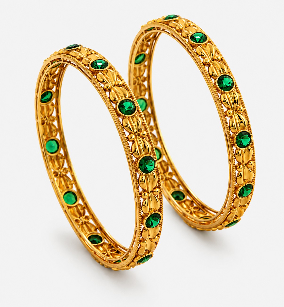 Golden Bangle With Elegant Design And Green Gemstone