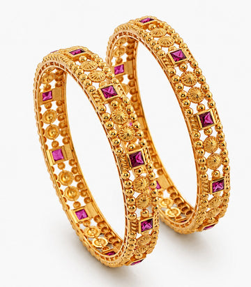 Pair Of Gold Bangles With Purple Stones