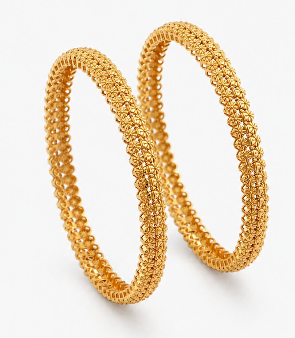Two Gold Bangles With Small Curved Designs
