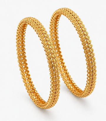 Two Gold Bangles With Small Curved Designs