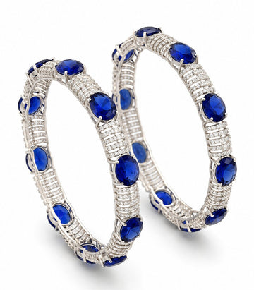 Bold Diamond Bangles Featuring Large Oval-Cut Blue Sapphires