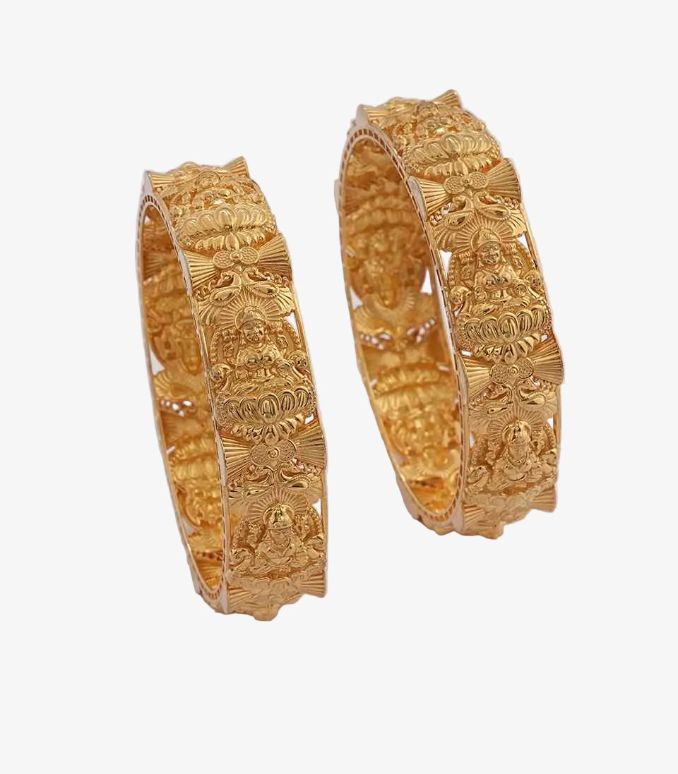 Kada bangles featuring high-relief carvings of Goddess Lakshmi seated on a lotus, framed by intricate floral and fan-shaped motifs.