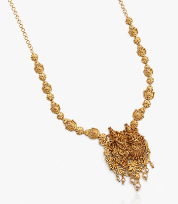 A Gold Temple Necklace Featuring A Central Pendant