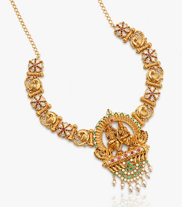 A Traditional Gold Temple Necklace Featuring A Large Circular Pendant