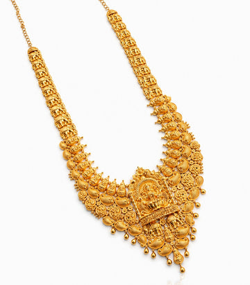 An Elaborate And Heavy Gold Necklace In A Traditional South Indian Temple Jewelry Style.