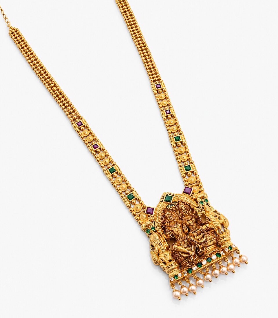 An Antique-Finish Gold Temple Haram Featuring A Large Rectangular Pendant