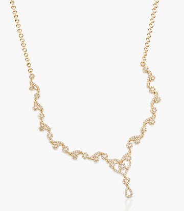 A Delicate Gold Necklace Featuring A Dainty Chain