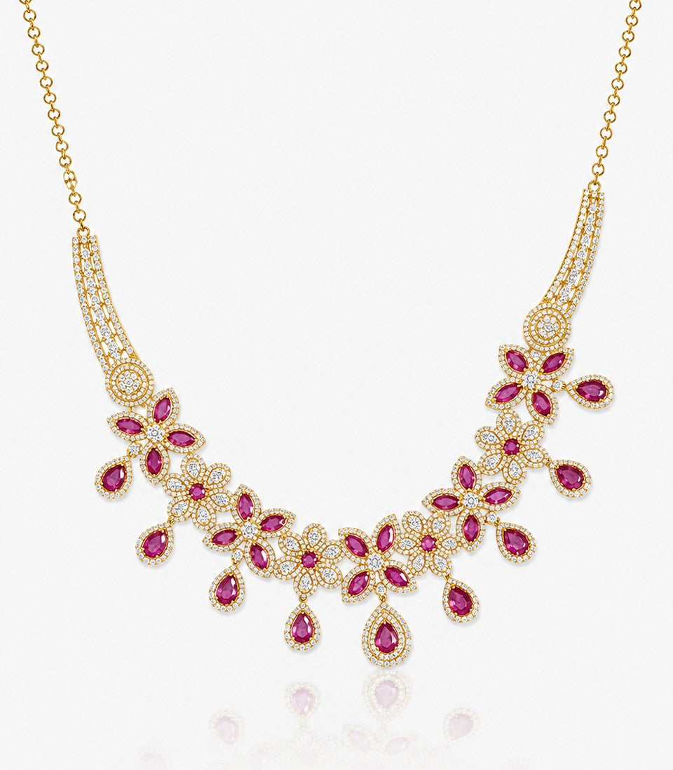 A Gold Floral Necklace Featuring Alternating Diamond