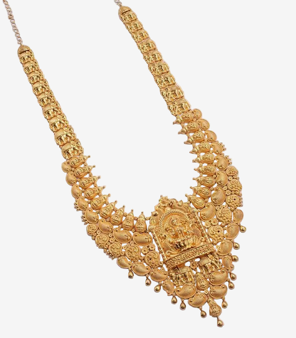 Gold necklace with intricate design on a light gray background