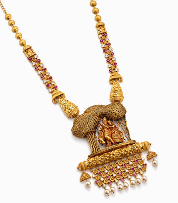 Antique Gold Necklace With Radha Krishna Motif & Pearl Drops