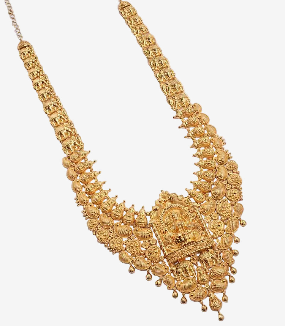 Gold necklace with intricate design on a light gray background