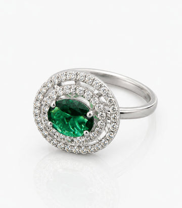 Ring With Large Green Gemstone Diamond Surround