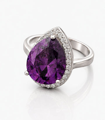 Ring With Large Purple Gemstone Centerpiece