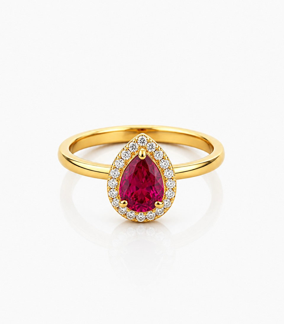 Gold Ring With Red Gemstone on Center And Diamonds tones