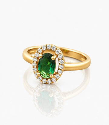 Gold Ring With A Green Gemstone And Diamond Accents