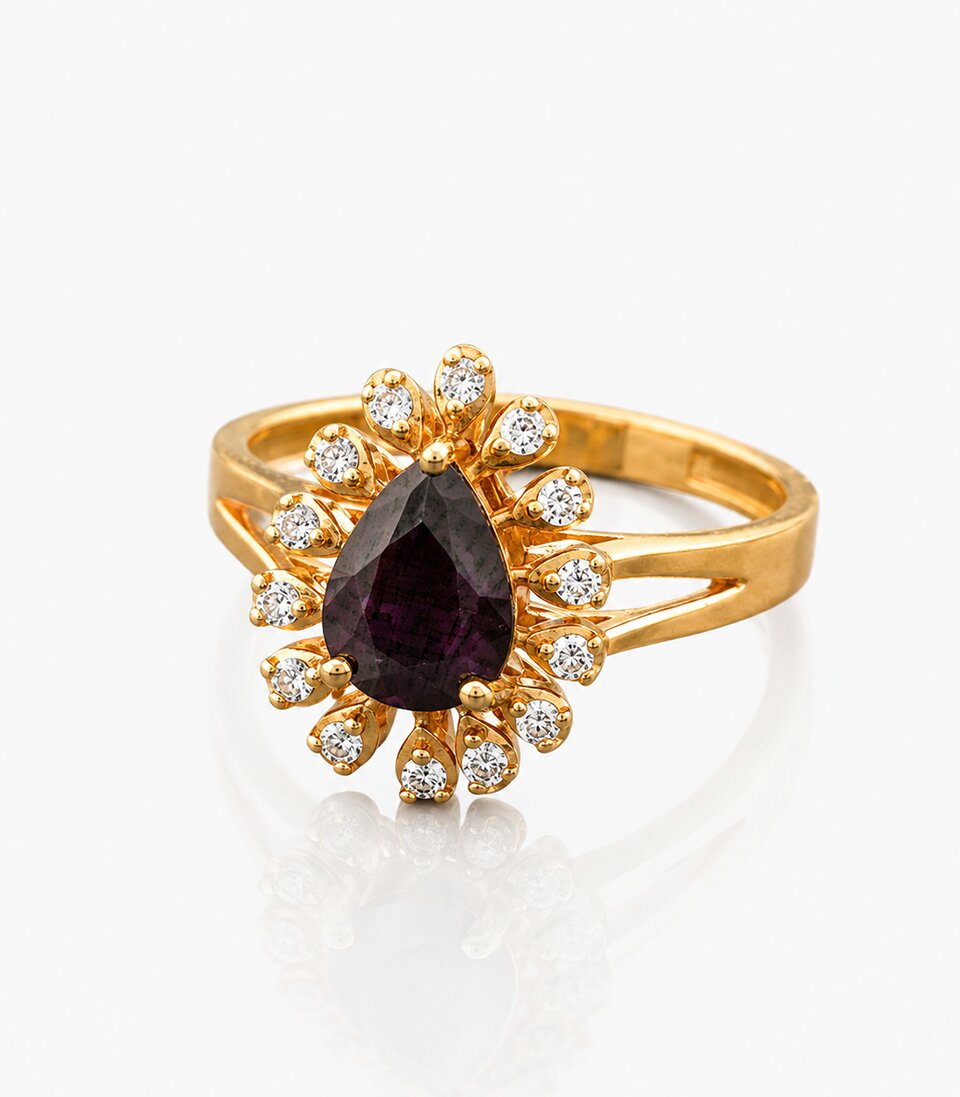 Gold ring with a central purple gemstone and diamond accents on a white background