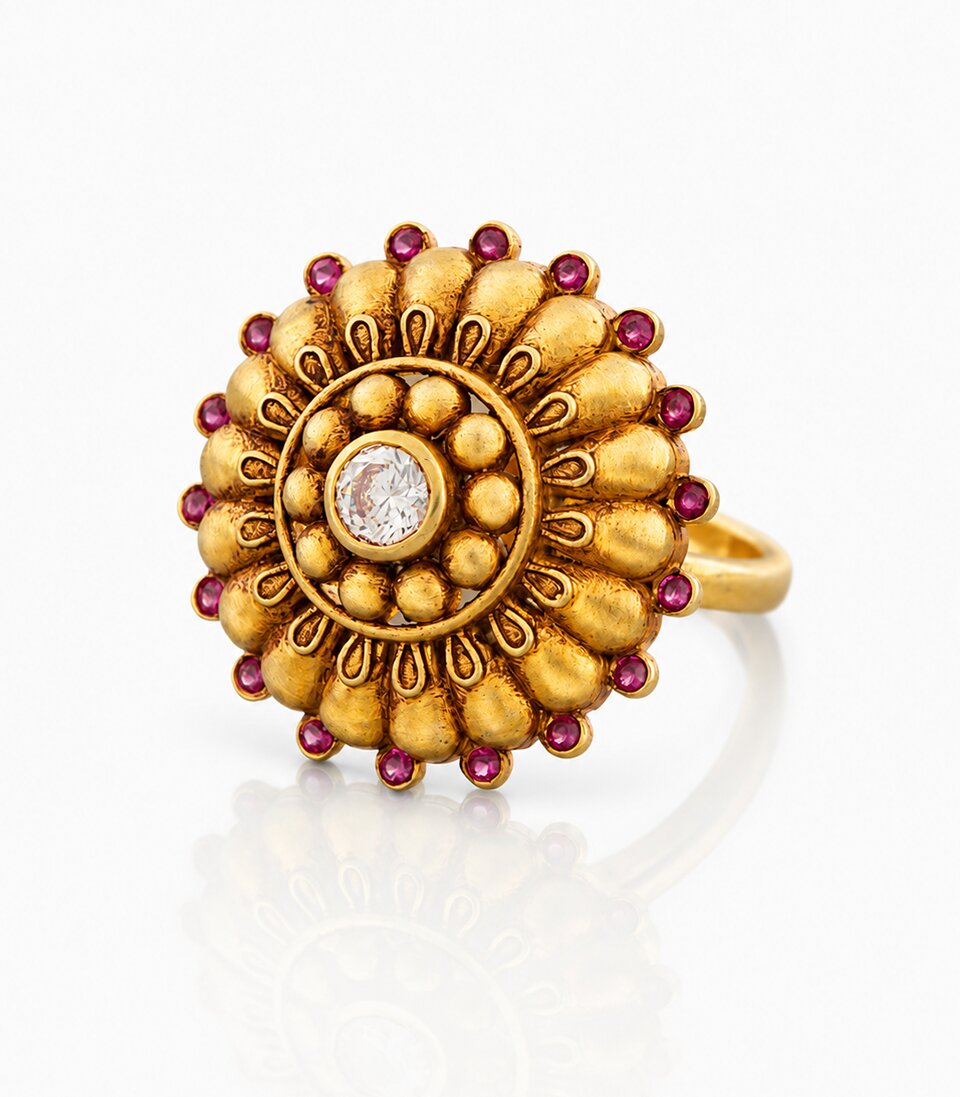 Striking Gold Ring Adorned with Brilliant Red Gemstones