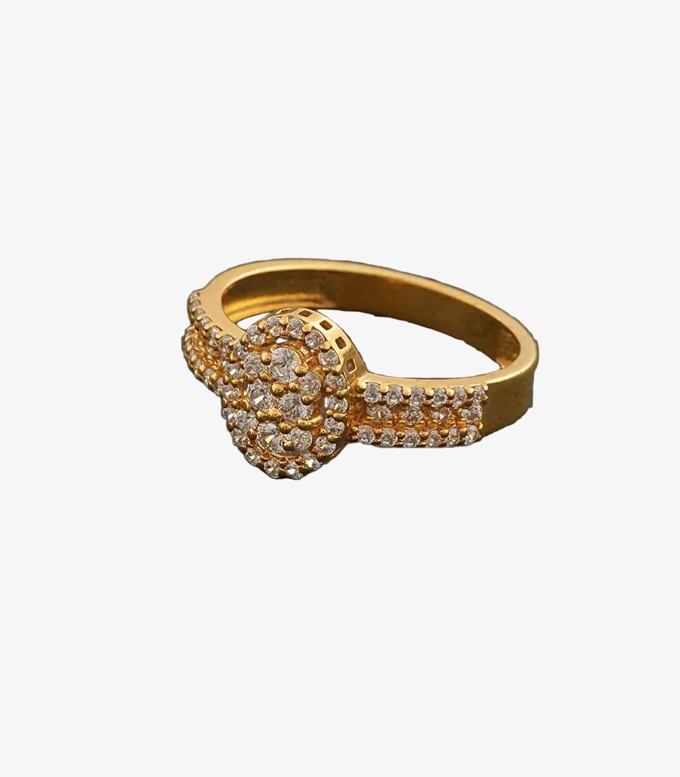 Gold ring with diamond accents on a gray background
